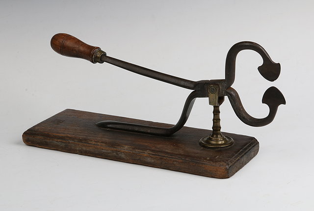 Appraisal: A PAIR OF GEORGIAN STEEL AND BRASS SUGAR CUTTERS mounted