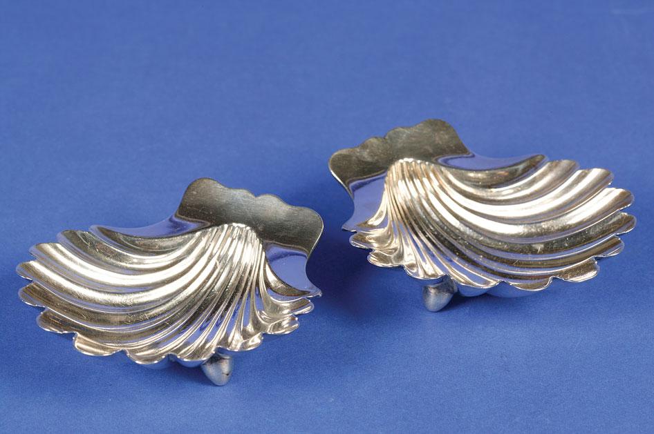 Appraisal: A PAIR OF GEORGE II BUTTER SHELLS of conventional form