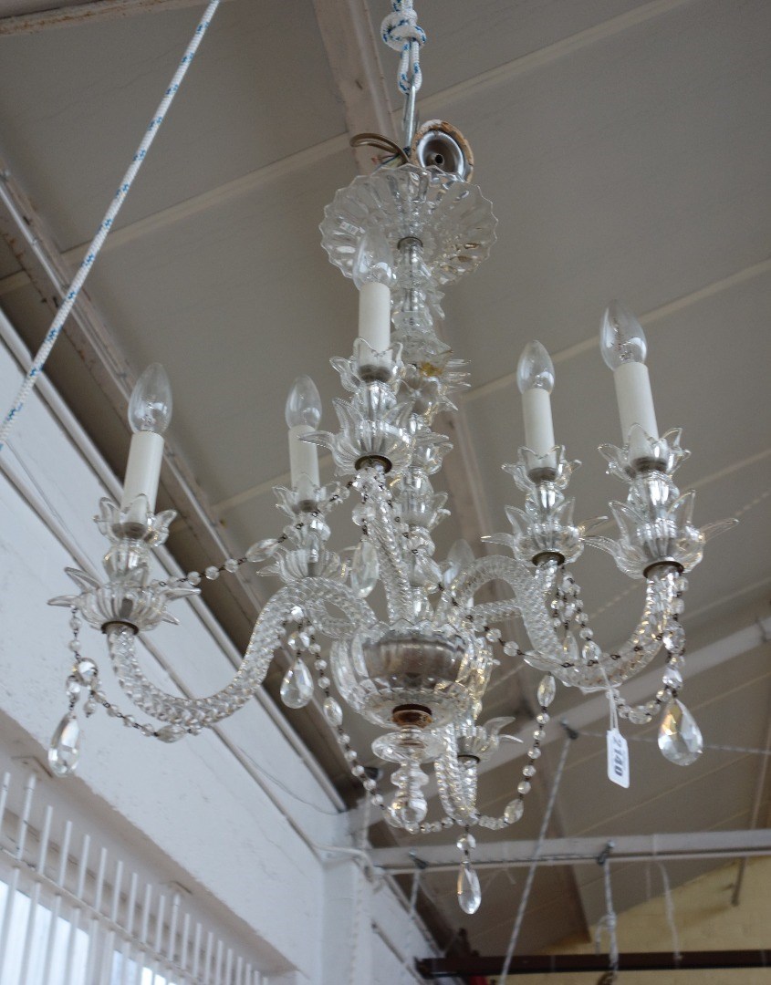 Appraisal: A six branch glass chandelier th century the moulded glass