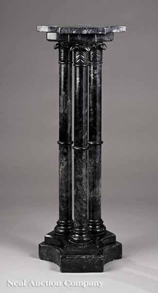 Appraisal: A Classical-Style Black Marble Pedestal incurvate plinth top three columnar