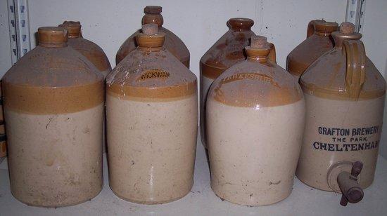 Appraisal: Eight brown glazed storage jars various local firms