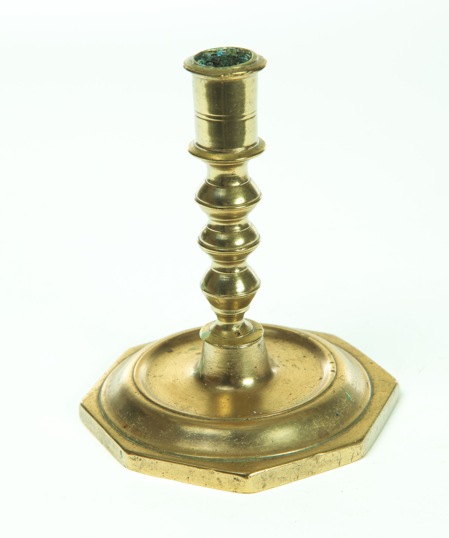 Appraisal: BRASS CANDLESTICK Probably Spain late th century Three knop stem