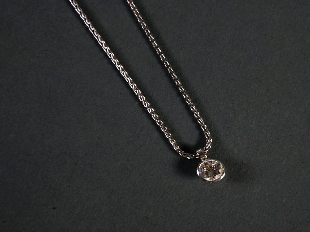 Appraisal: PLATINUM CHAIN NECKLACE AND PENDANT collet set with a solitaire