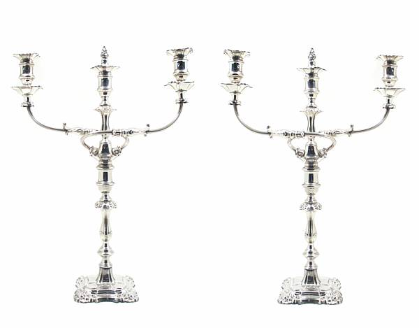 Appraisal: A pair of plated candlesticks with adjustable three light branches