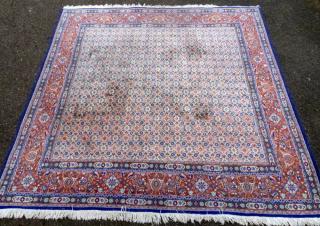 Appraisal: Persian type rug the centre with repeating floral medallions cm