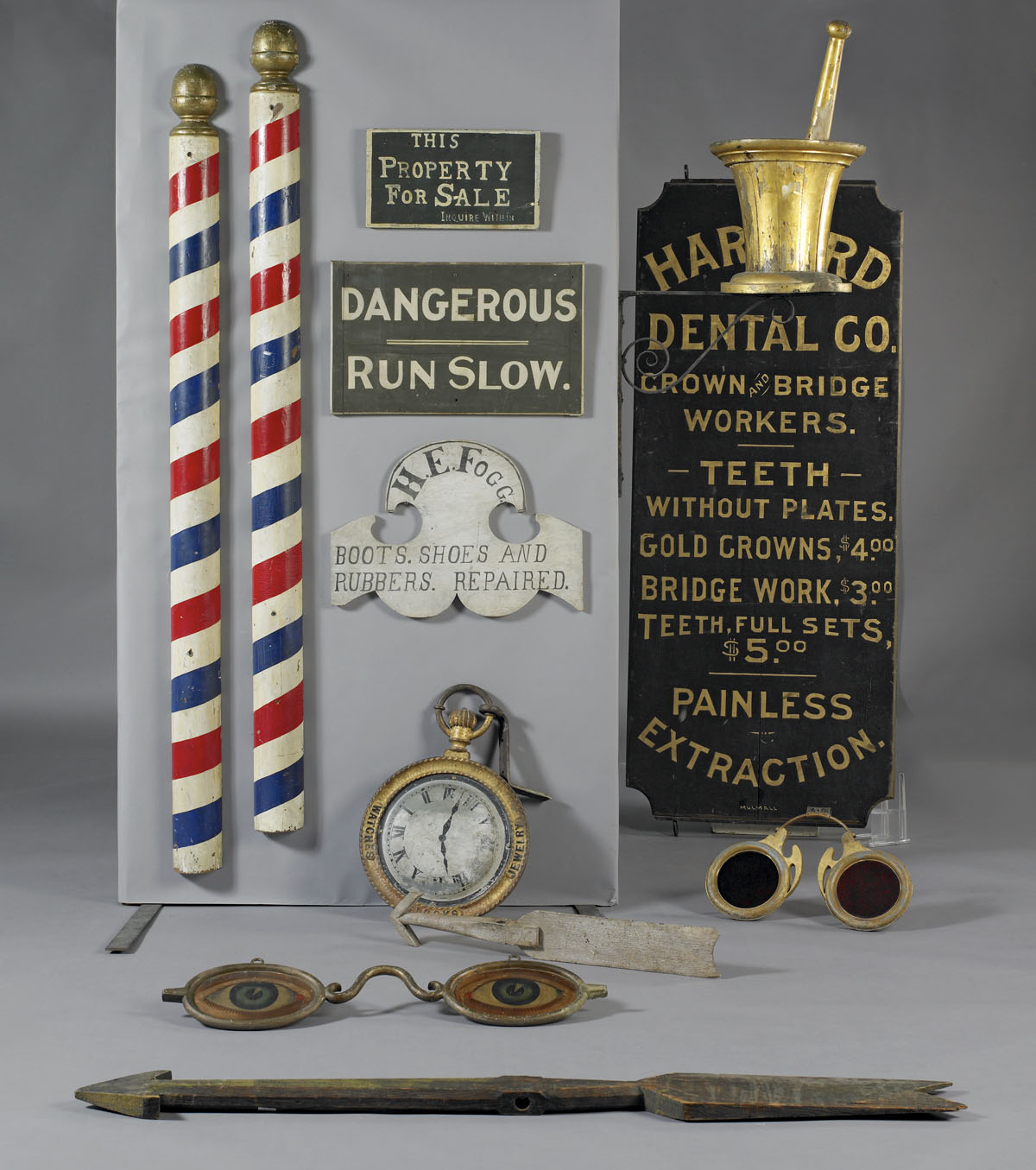 Appraisal: PAIR OF AMERICAN HALF-ROUND RED WHITE AND BLUE BARBER POLES