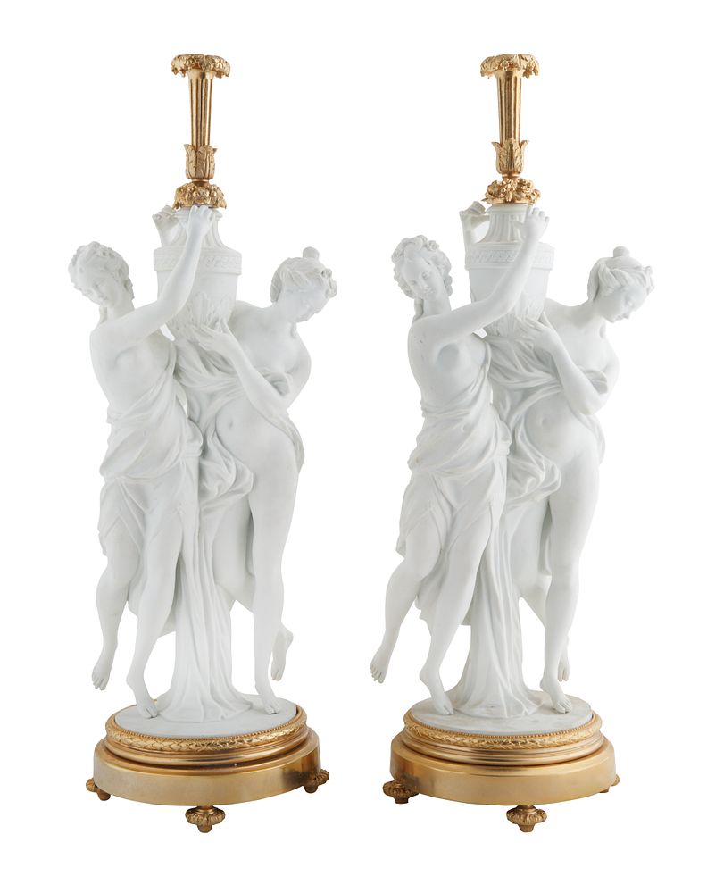 Appraisal: PAIR OF NEOCLASSICAL STYLE BISQUE CERAMIC MAIDEN LAMPS PAIR OF