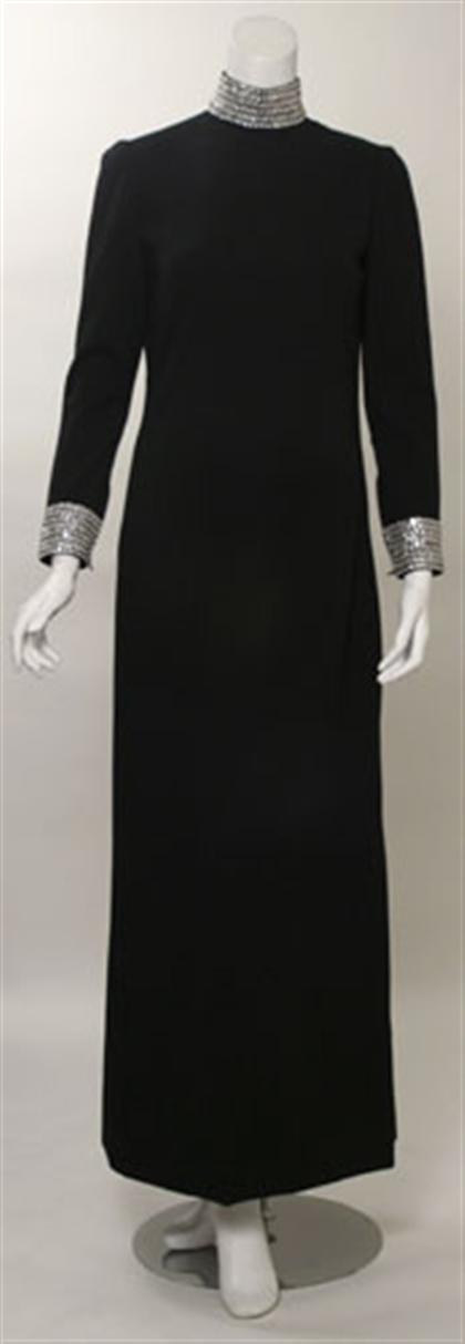 Appraisal: Norell-Tassell black jersey wool gown Full-length long sleeve column gown