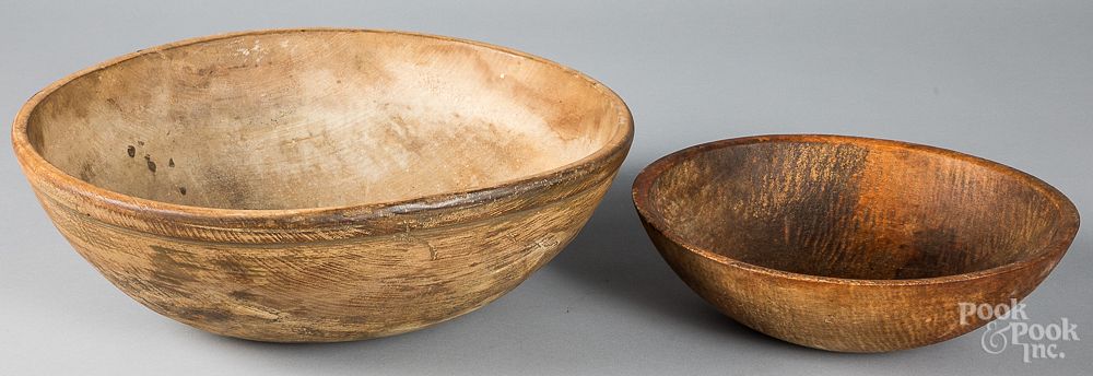 Appraisal: Two turned wood bowls th th c Two turned wood