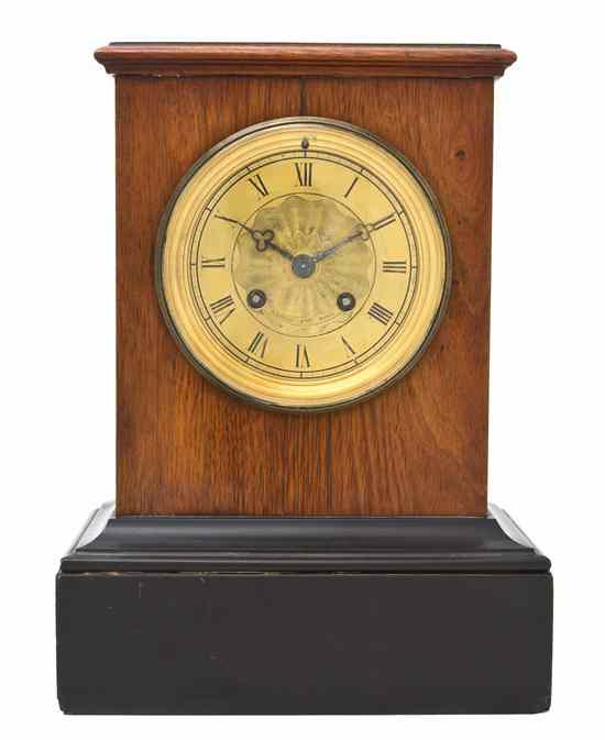 Appraisal: A French Fruitwood Mantel Clock Raingo Fres with a rectangular