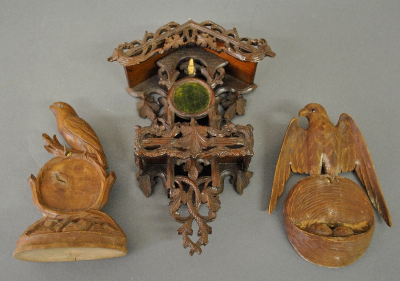 Appraisal: - Three Black Forest carved watch holders to include two