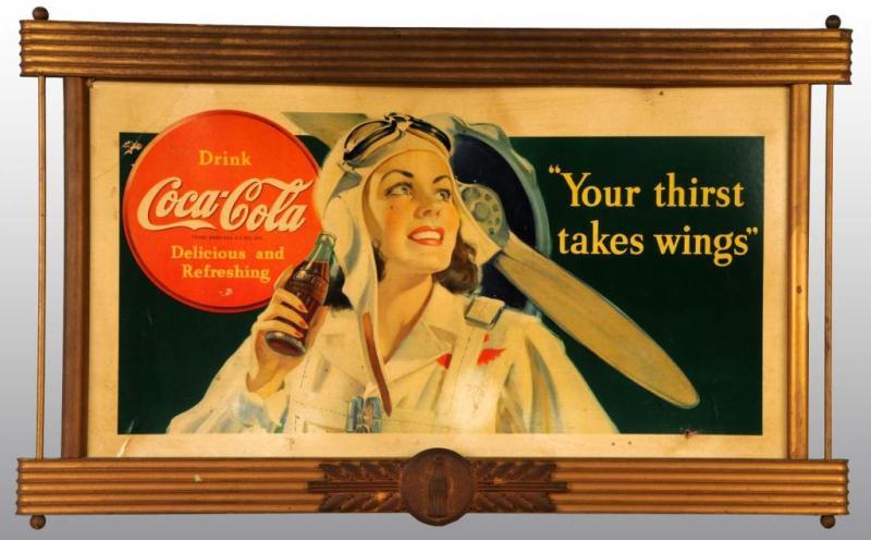 Appraisal: Cardboard Coca-Cola Aviator Sign Description Framed in original wooden frame