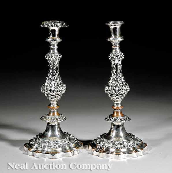 Appraisal: A Pair of Sheffield Plate Candlesticks th c ornate acanthus