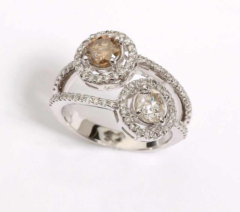 Appraisal: A two-stone diamond and K white gold by-pass ring with