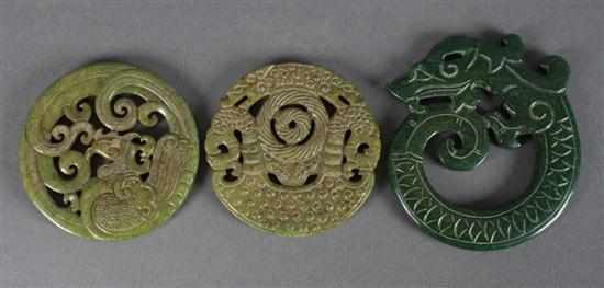 Appraisal: Three Chinese archaic style dragon carved green hardstone disks to