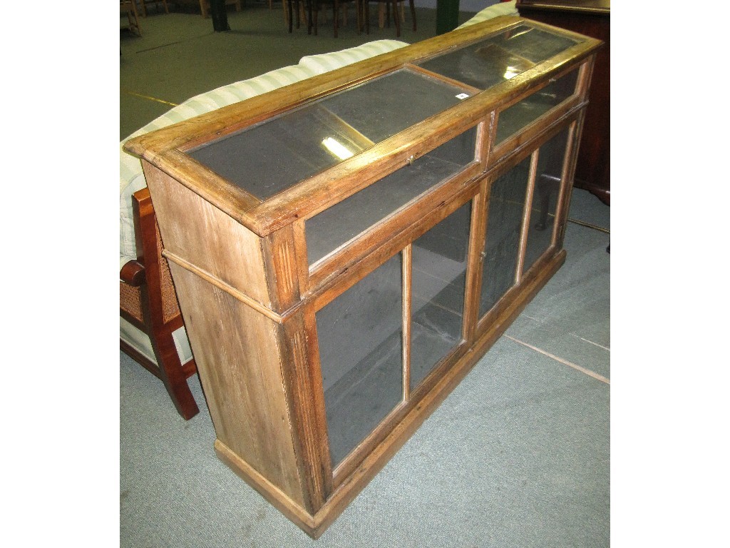 Appraisal: Victorian pine door shop display case with glazed doors