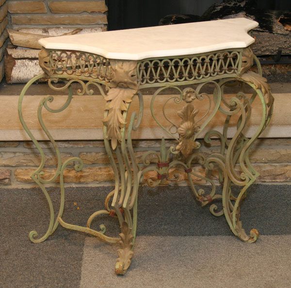 Appraisal: Ornate cast metal table with marble top old painted surface