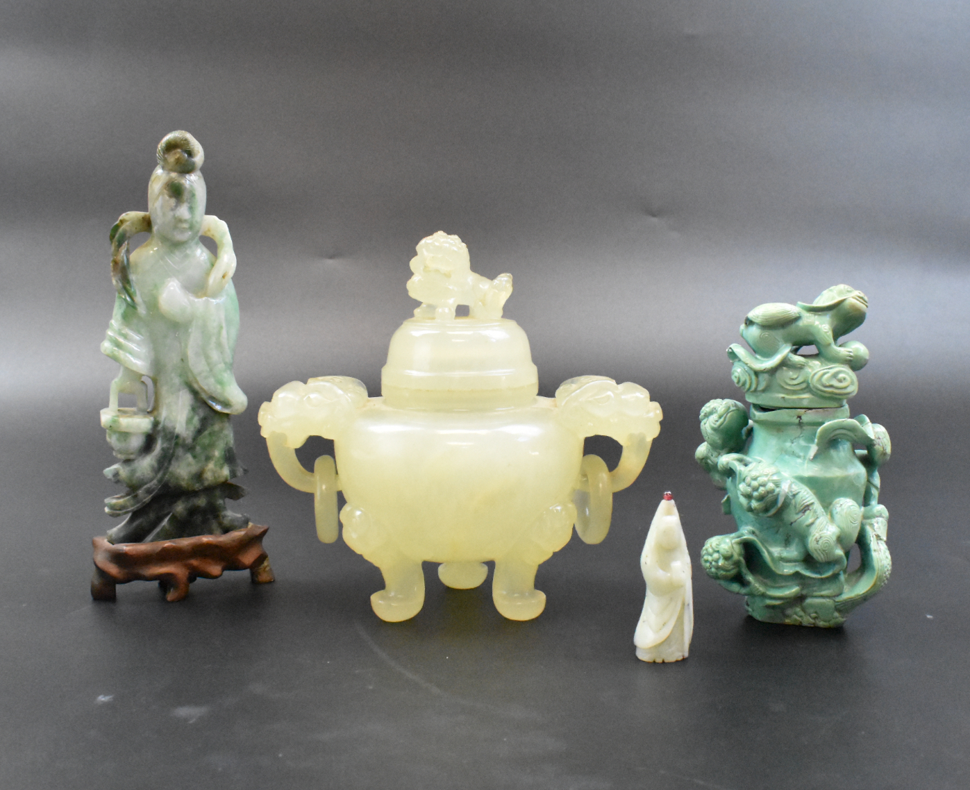 Appraisal: A group of Chinese jade and turquoise carvings A jade