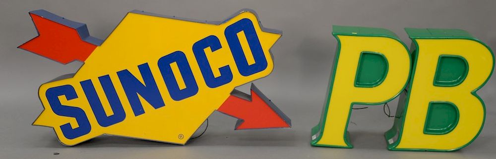 Appraisal: Three advertising signs including a signed light-up Sunoco ht in