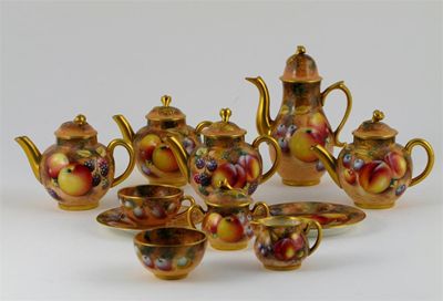 Appraisal: A collection of Royal Worcester miniature teawares painted with fruit