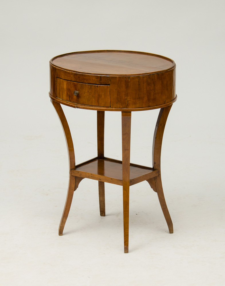 Appraisal: DIRECTOIRE PROVINCIAL FRUITWOOD SIDE TABLE The oval top above one