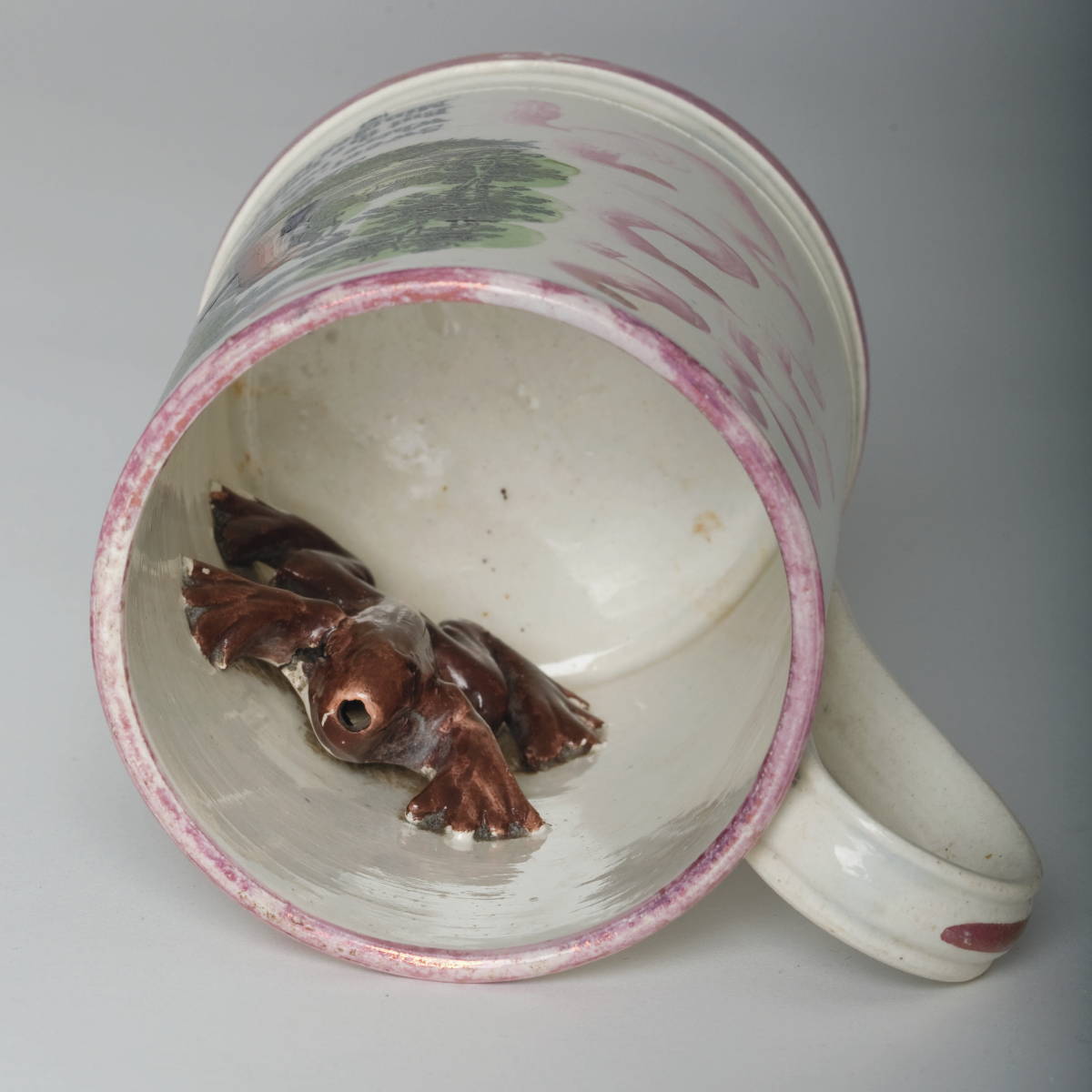 Appraisal: SUNDERLAND PINK LUSTRE ENAMEL-DECORATED AND BLACK TRANSFER-PRINTED FROG MUG CIRCA