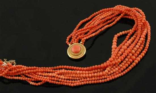 Appraisal: A multi-strand coral necklace Comprising eight graduated strands of coral