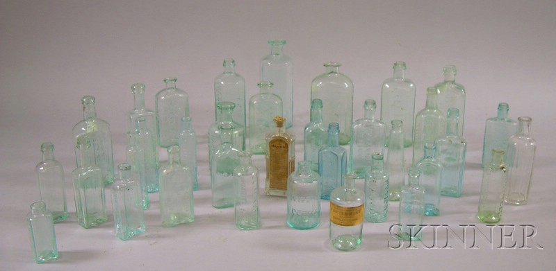 Appraisal: Thirty-five Aqua Mostly Embossed Pontiled Glass Medicine and Ink Bottles