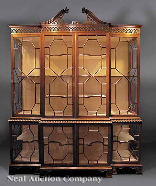 Appraisal: A Chinese Chippendale-Style Carved Mahogany Breakfront Display Cabinet reticulated broken