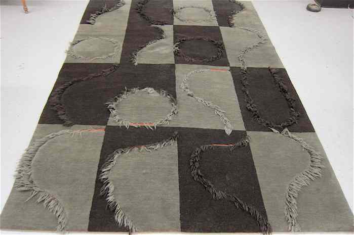 Appraisal: HAND KNOTTED NEPALI CARPET contemporary -tone gray panel design with