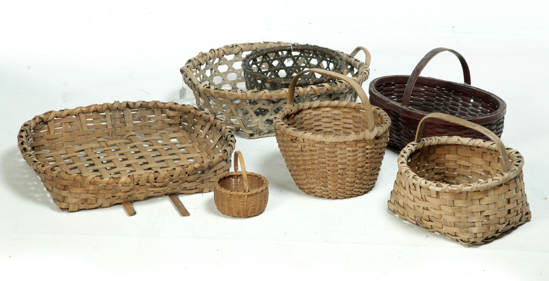 Appraisal: SEVEN BASKETS American late th-early th century wood split Three