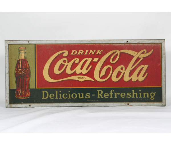 Appraisal: Vintage framed tin advertising Coca-Cola sign with multi-color painted bottle