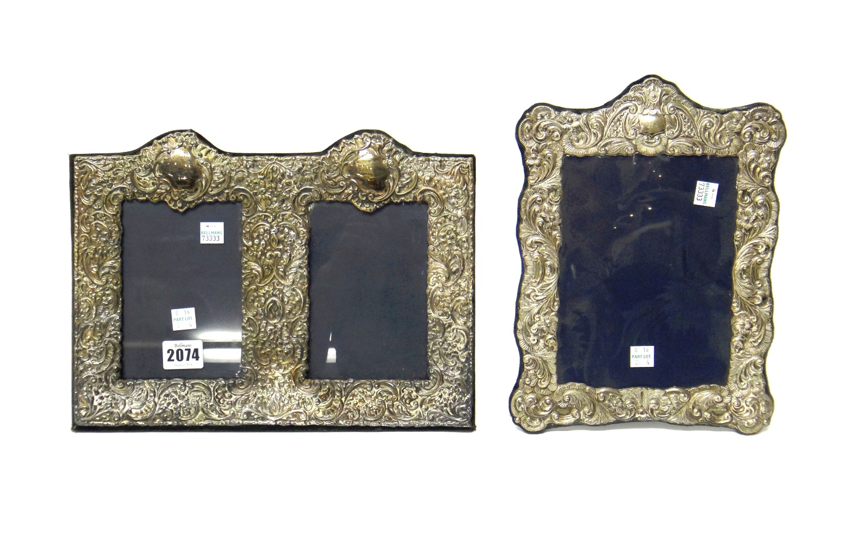 Appraisal: A silver mounted twin compartment photograph frame having floral foliate