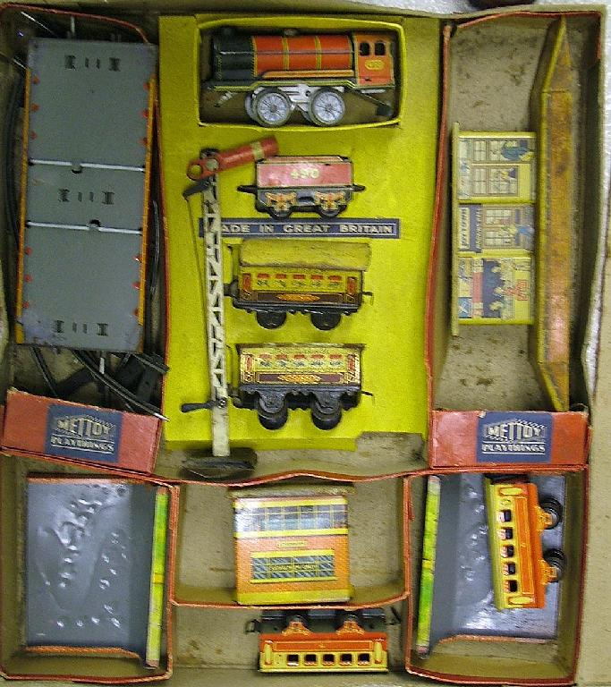 Appraisal: Boxed early th century Mettoy Playthings painted tin train set