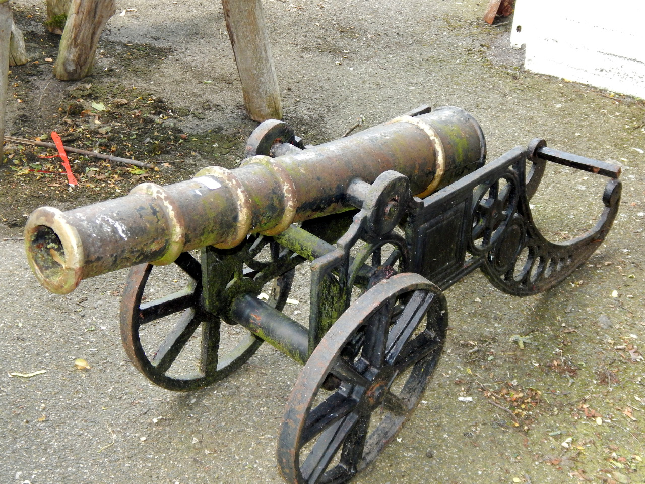 Appraisal: A cast iron garden cannon black and gold painted cm