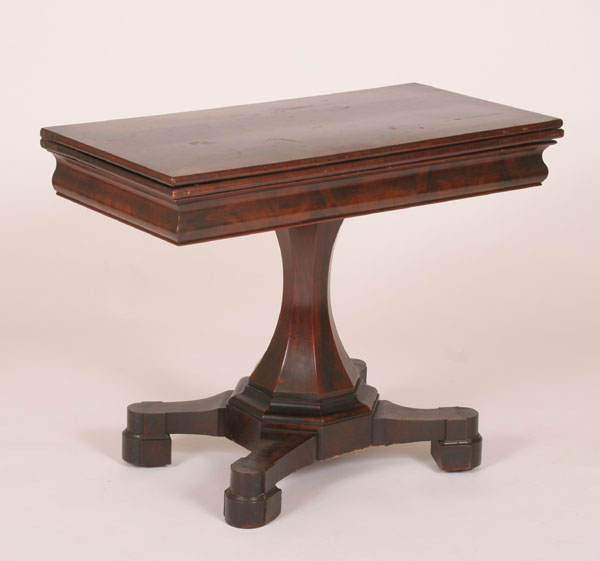 Appraisal: Empire style mahogany game table flared paneled pedestal base pad