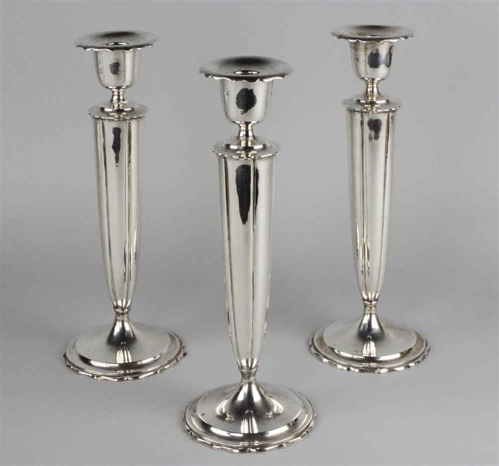 Appraisal: THREE WEIGHTED STERLING CANDLEHOLDERS marked sterling RD for Richard Dimes