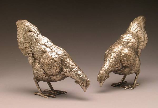 Appraisal: A pair of silvered metal pecking chickens modern height in