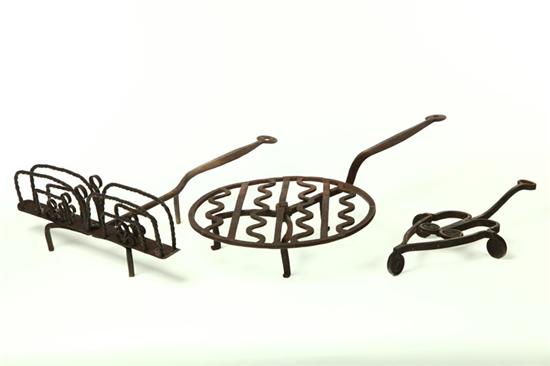 Appraisal: WROUGHT IRON TOASTER GRIDDLE AND TRIVET American th century Revolving