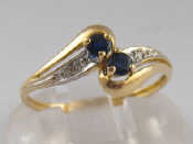 Appraisal: A yellow metal tests carat gold diamond and sapphire ring