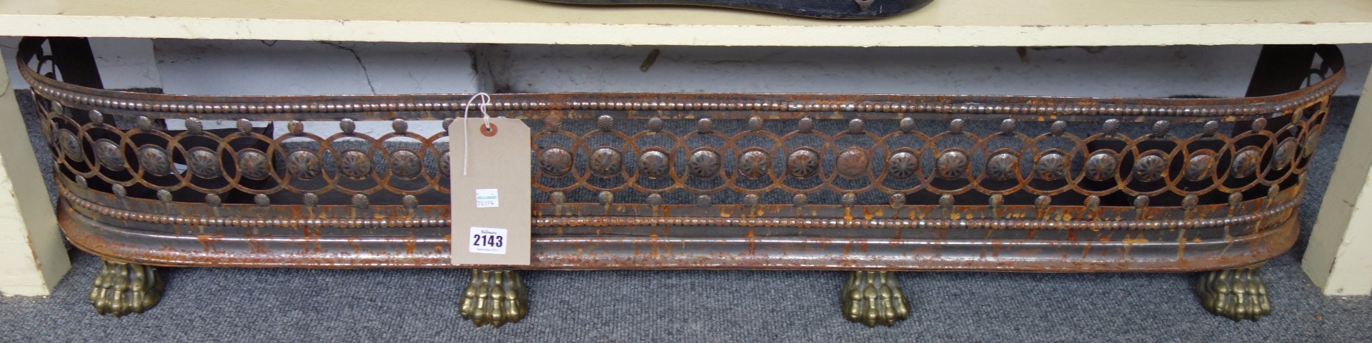 Appraisal: A Victorian steel and brass mounted fire curb with pierced