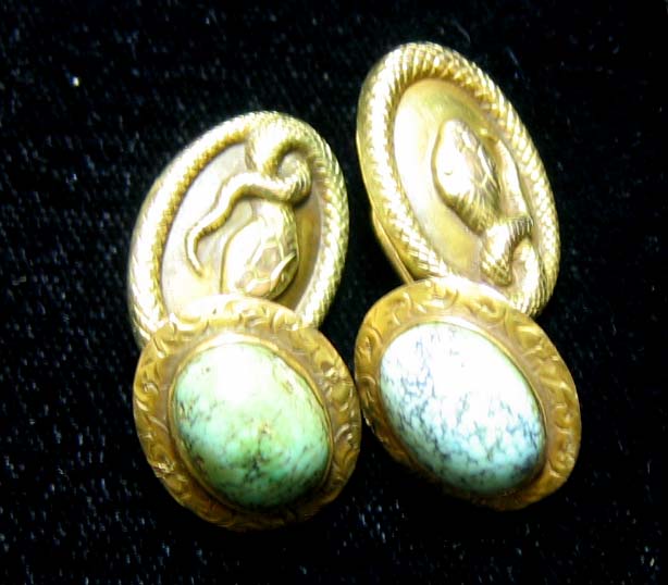 Appraisal: SNAKE DESIGN AND STONE CUFFLINKS Yellow gold with snake emblem