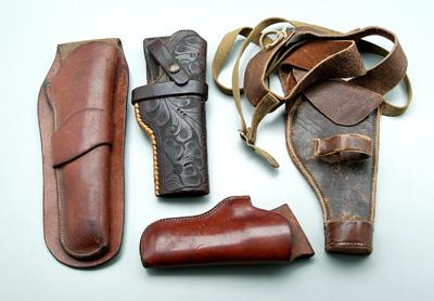 Appraisal: Four Heiser leather holsters one tooled leather marked quot -