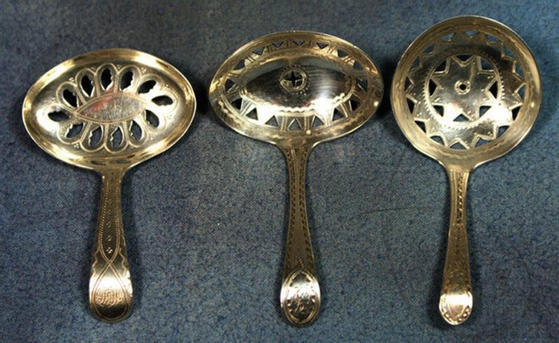 Appraisal: Georgian silver tea caddy spoons engraved design pierced bowls GB