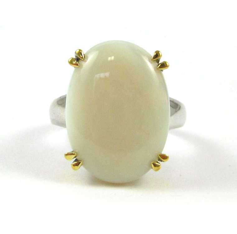 Appraisal: OPAL AND FOURTEEN KARAT GOLD RING The white ring with