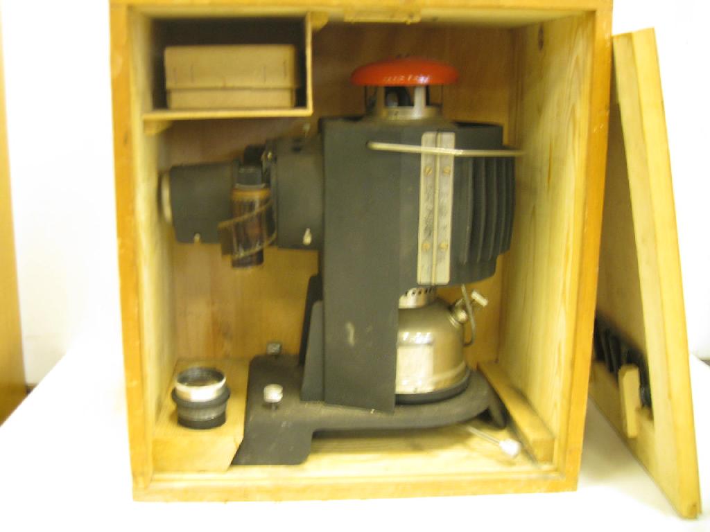 Appraisal: A mm Optimar Film Projector with Tilley lamp style illumination