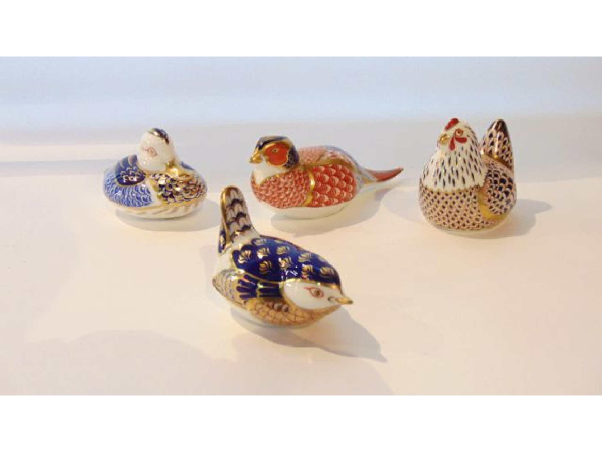 Appraisal: A collection of four Royal Crown Derby paperweights with Imari