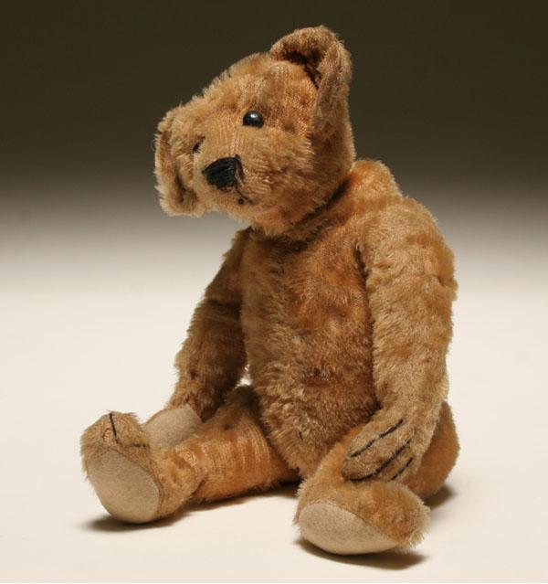 Appraisal: Four teddy bears smal early jointed cinnamon bear small jointed