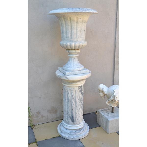 Appraisal: A CLASSICAL STYLE FLUTED MARBLE URN ON A COLUMNAR MARBLE