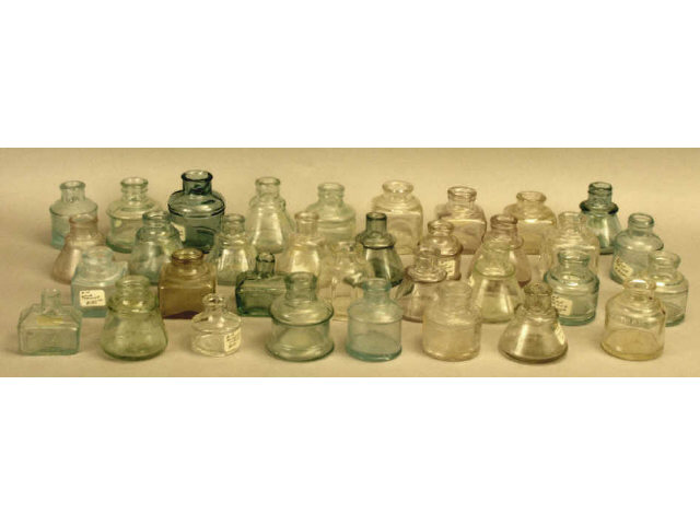 Appraisal: Large piece collection of early glass inkwell bottles in clear